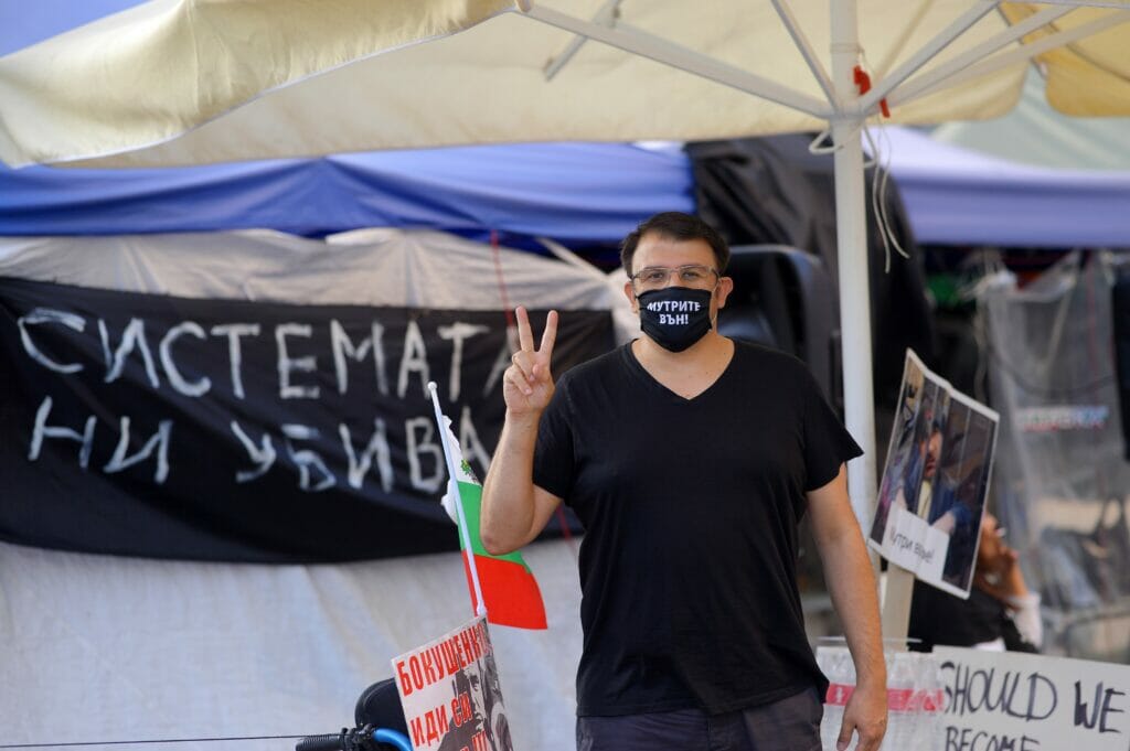 “Mafia out” is written on the mask that Ananiev wears to the protests — and also from time to time outside of them.